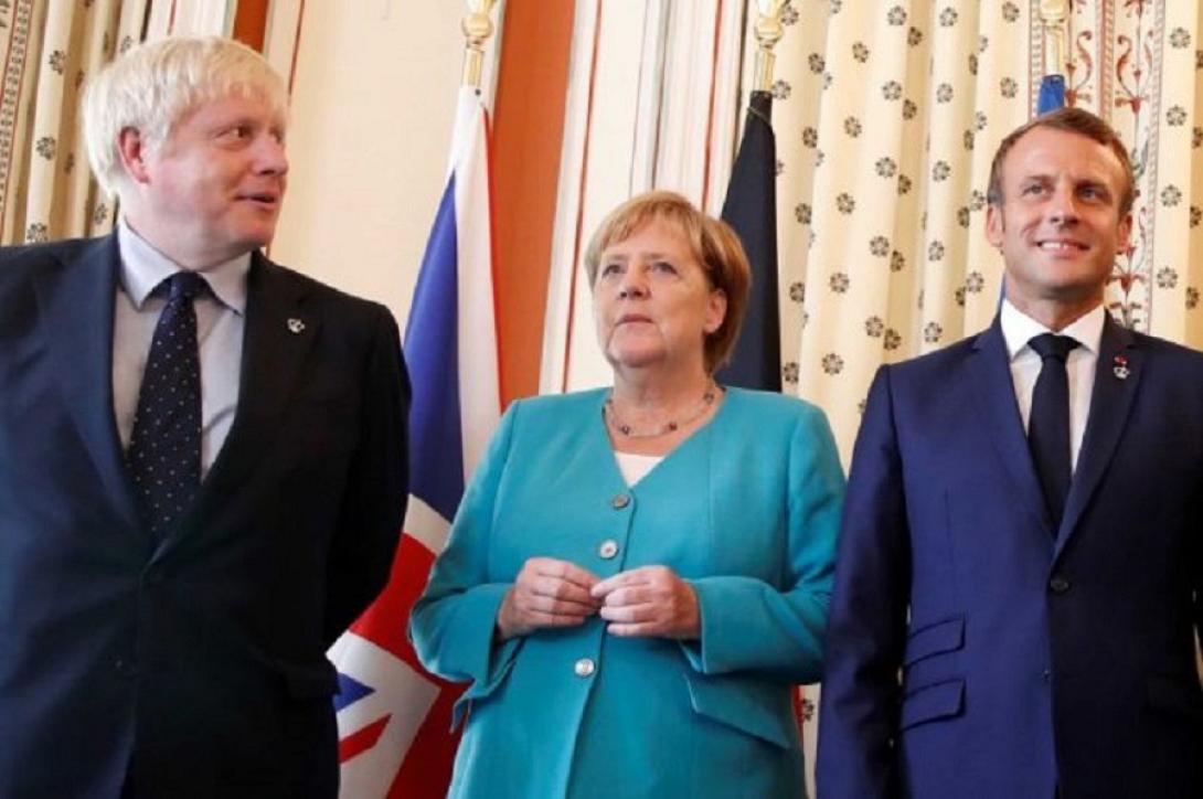 Η κ.Μερκελ με Μακρον και Τζονσον