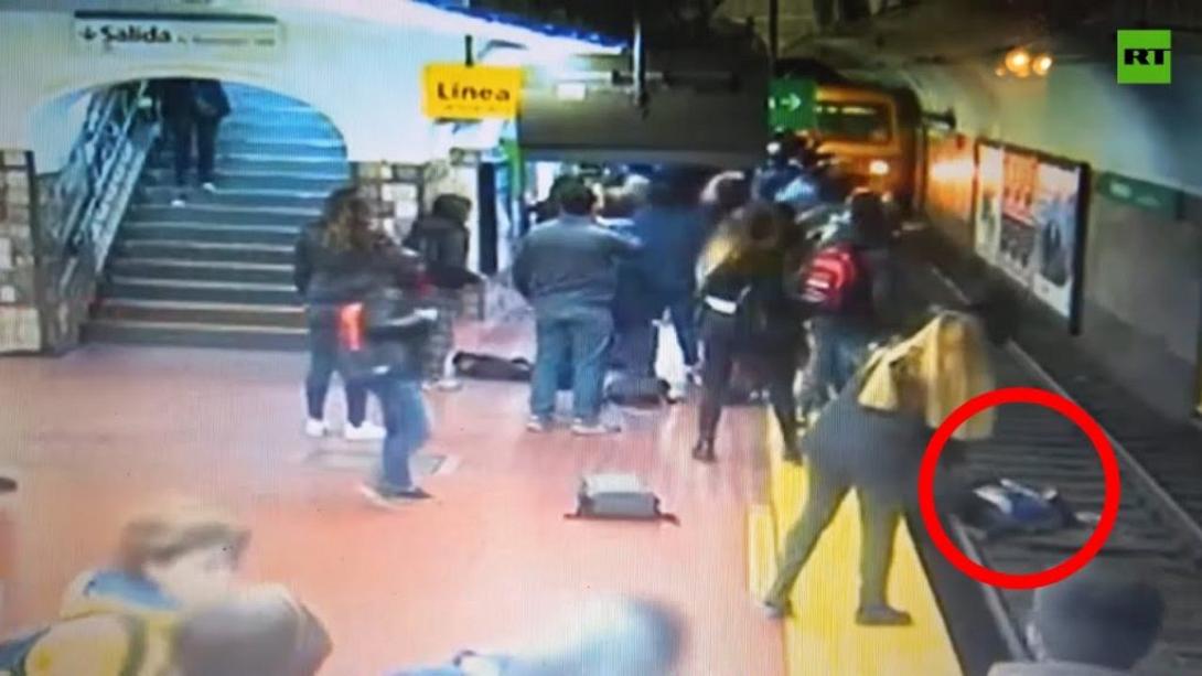 fainted-man-knocks-woman-onto-tracks-in-front-of-oncoming-1024x576.jpg